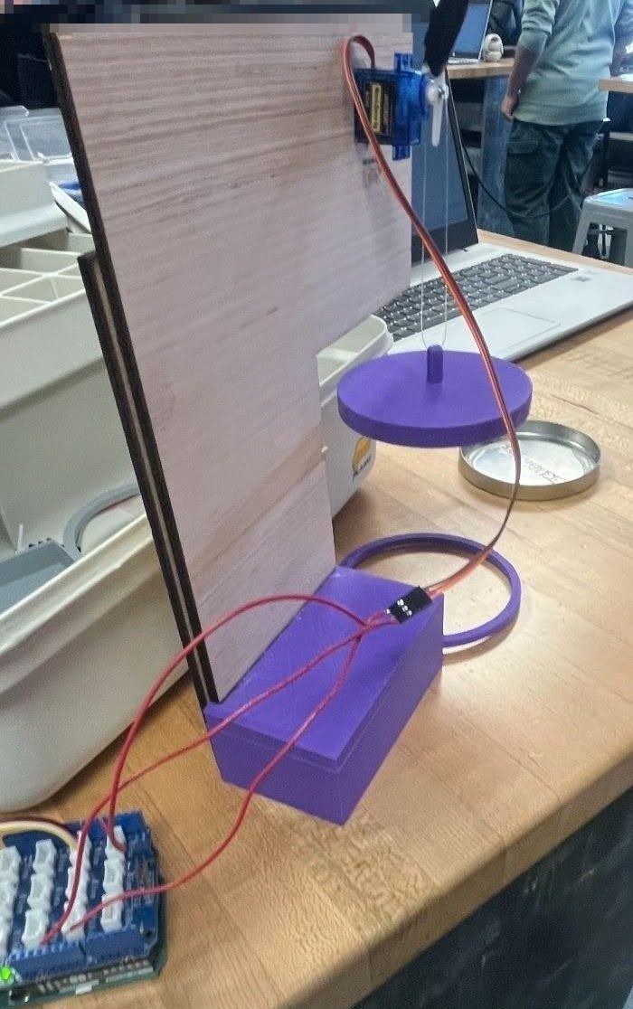 Automated candle extinguisher arm swinging a cap over a candle, servo-driven and mounted on a laser-cut stand