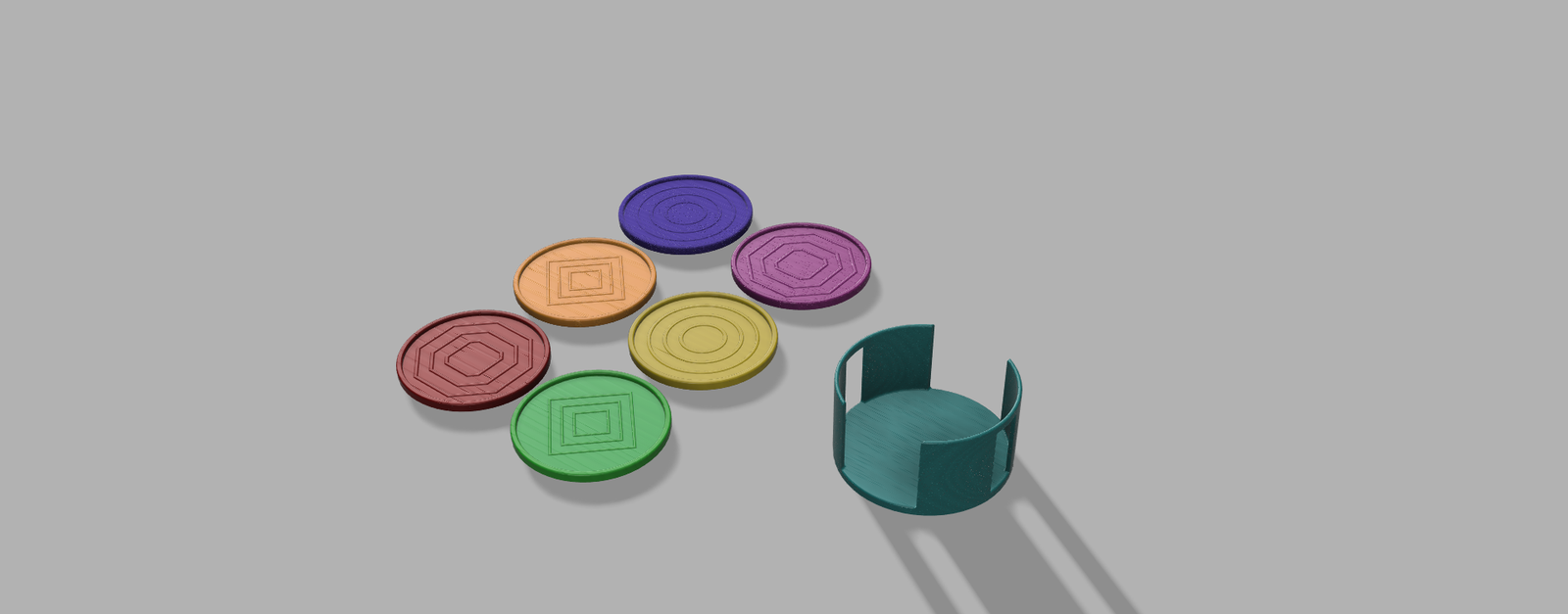 Rendered set of colorful engraved coasters next to a napkin ring