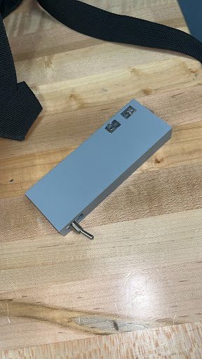3D-printed rectangular flashlight housing with a wrist strap
