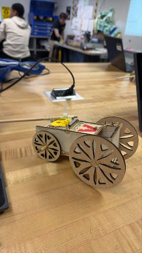 Finished mousetrap car with laser-cut flower-pattern wheels