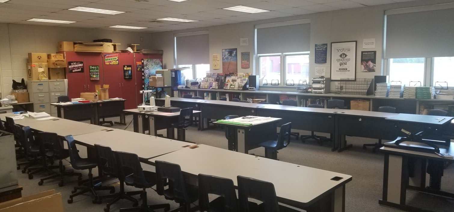 Before: the same classroom from another angle, with filing cabinets and storage still in place
