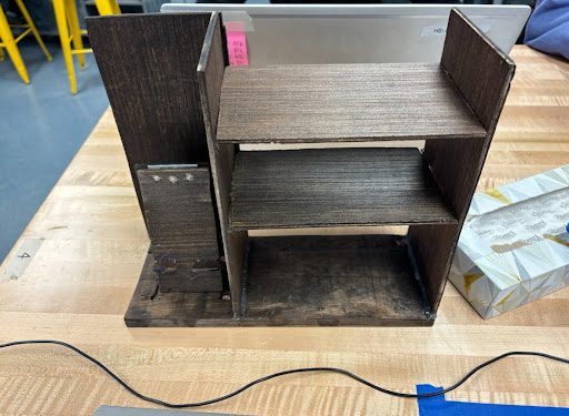 Dark-stained wooden multi-tier shelf-style phone stand