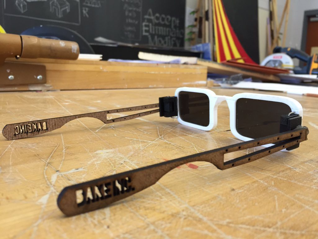 Laser-cut wooden sunglasses with 3D printed white frame