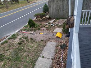 Drain line run stretching back toward the raised bed garden where it outlets