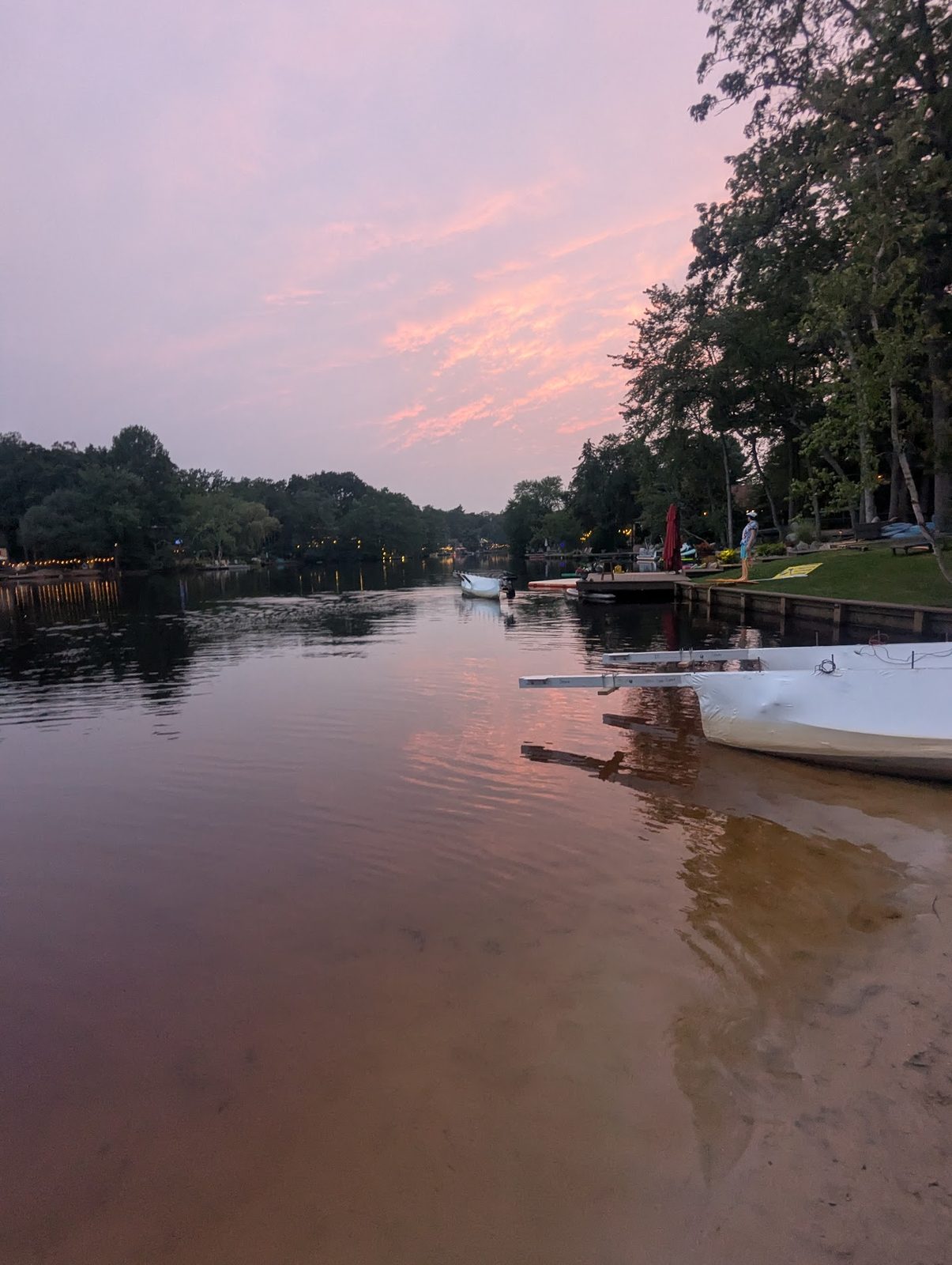 Dusk view of the lake with the float platform being prepped in the water