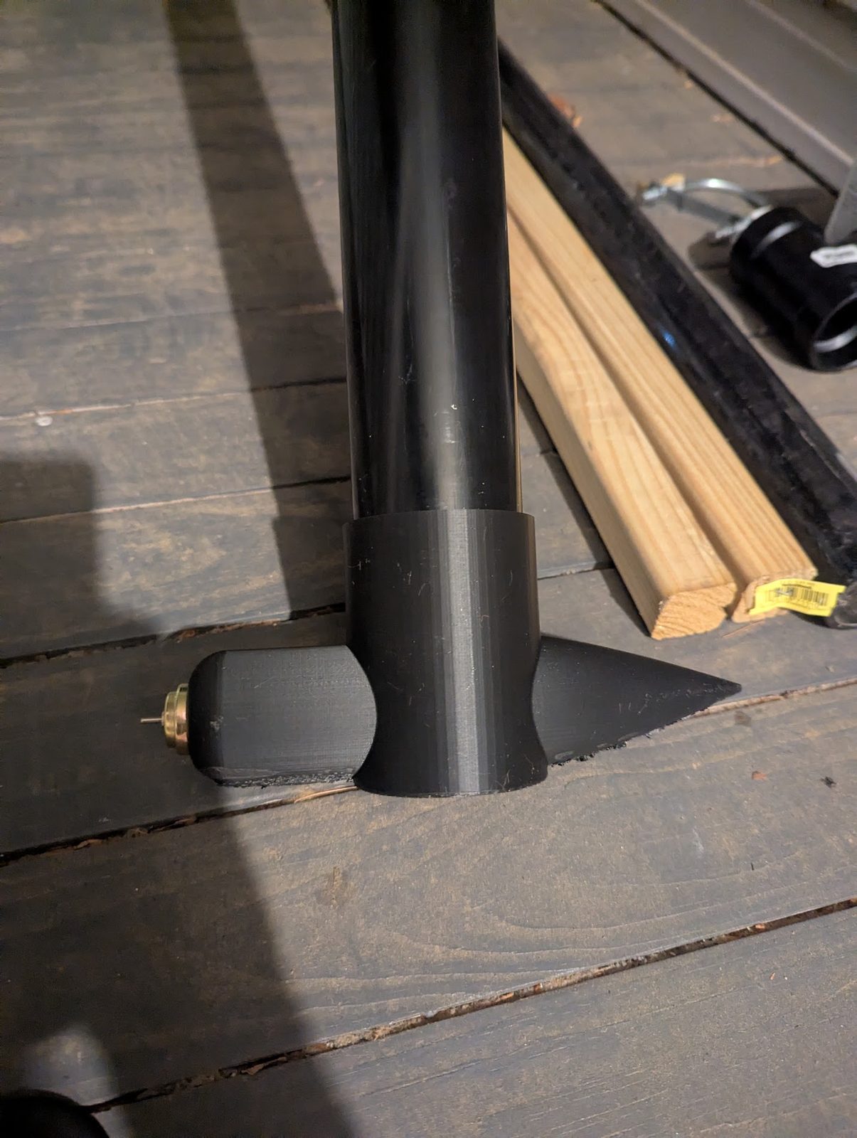 3D-printed nose cone fitted onto a PVC frame pole
