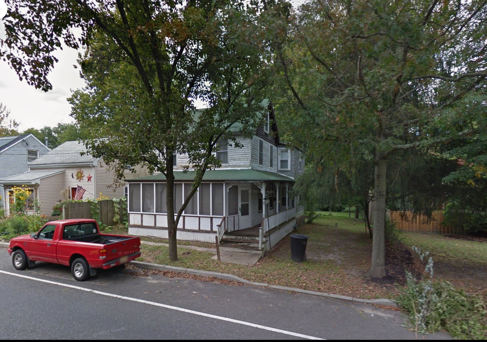 Google Street View capture of the house years before we bought it, still with its original screened-in porch