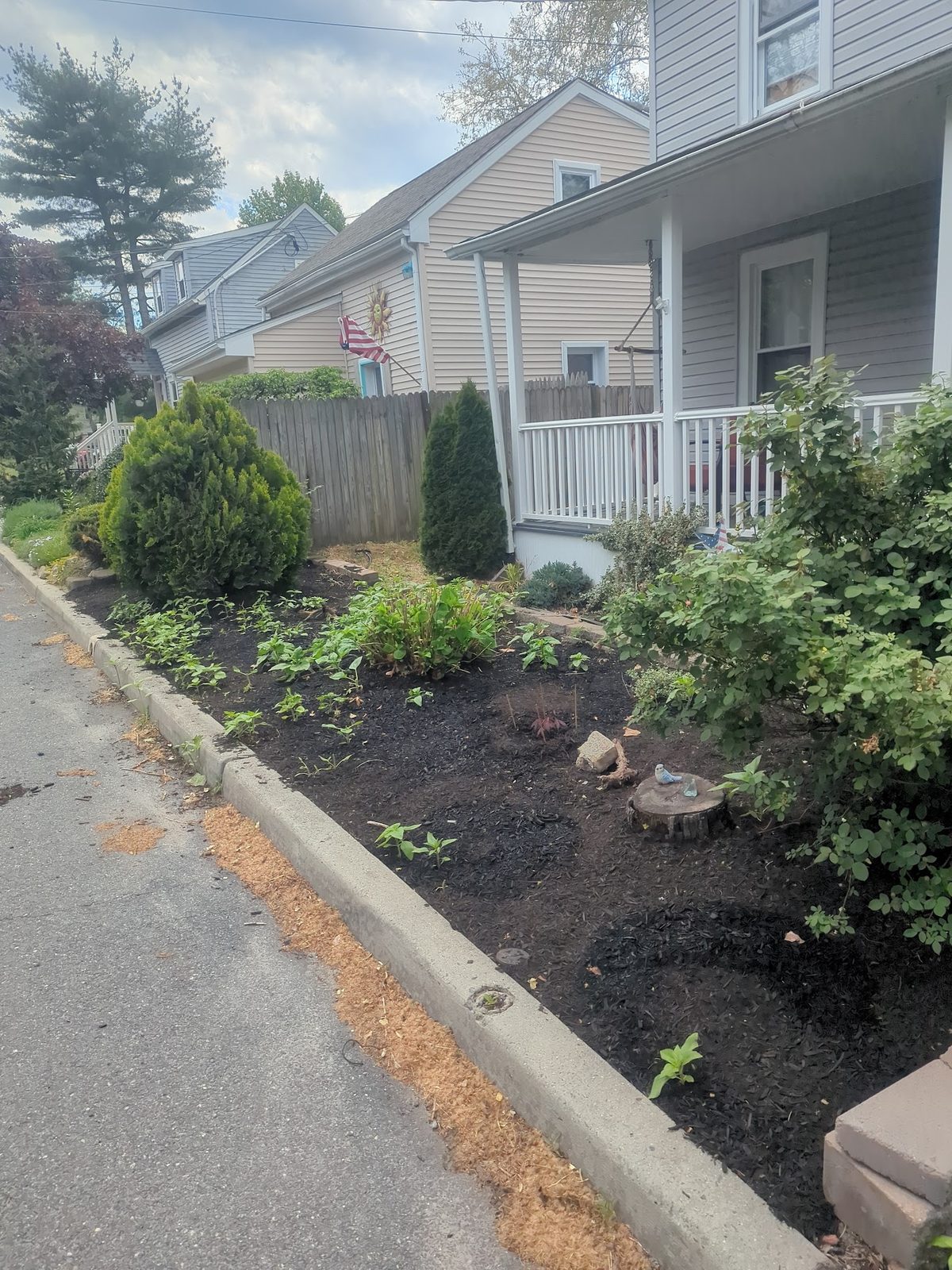 Foundation planting bed with fresh mulch along the front walk