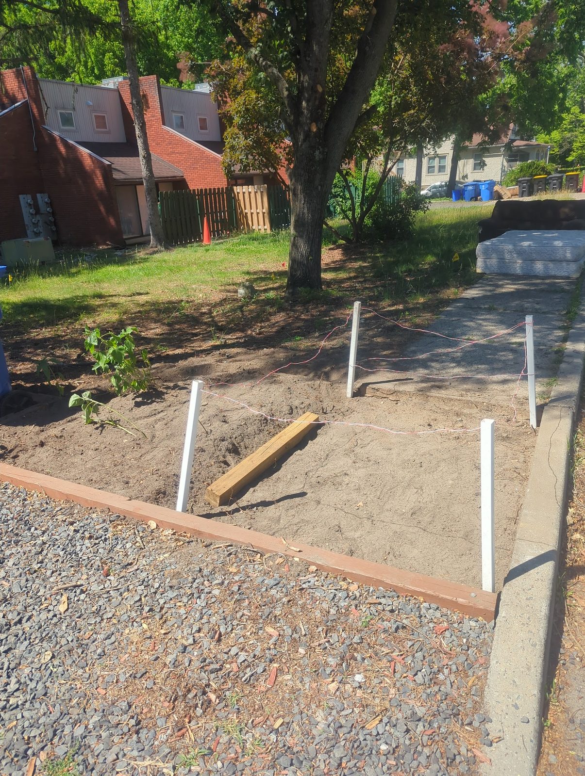 String lines and stakes laying out the new front walkway