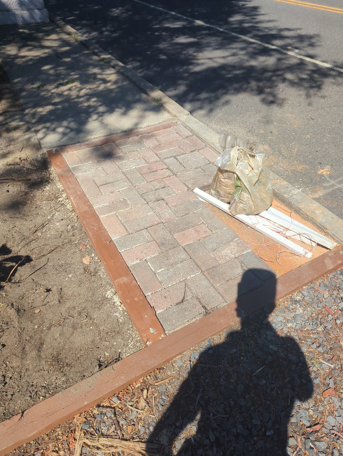 Finished brick walkway laid in the sand base