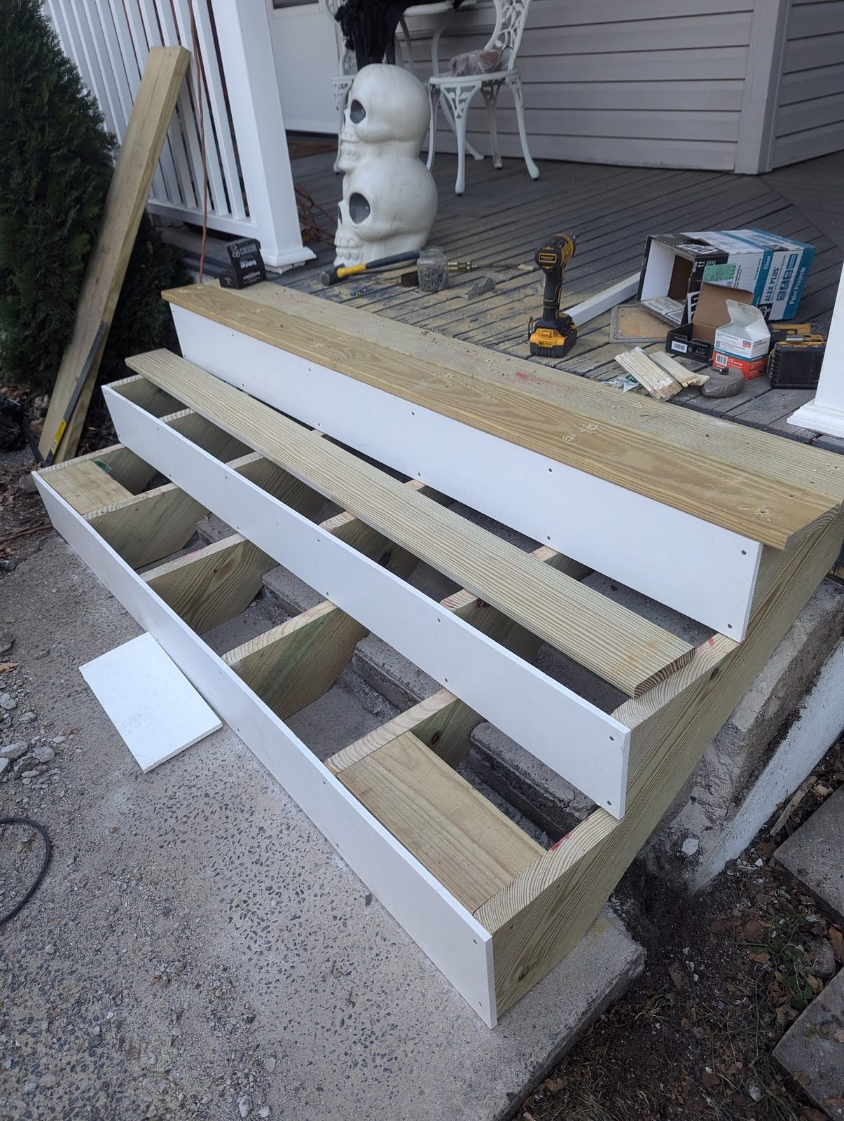 New porch steps being framed and painted white
