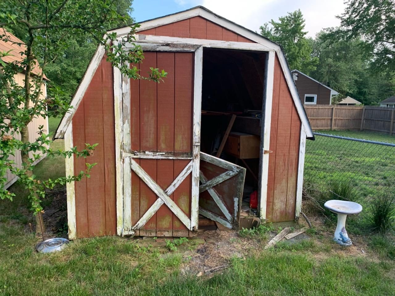 Old weathered red shed on a property a town over, barn doors open, before I took it apart