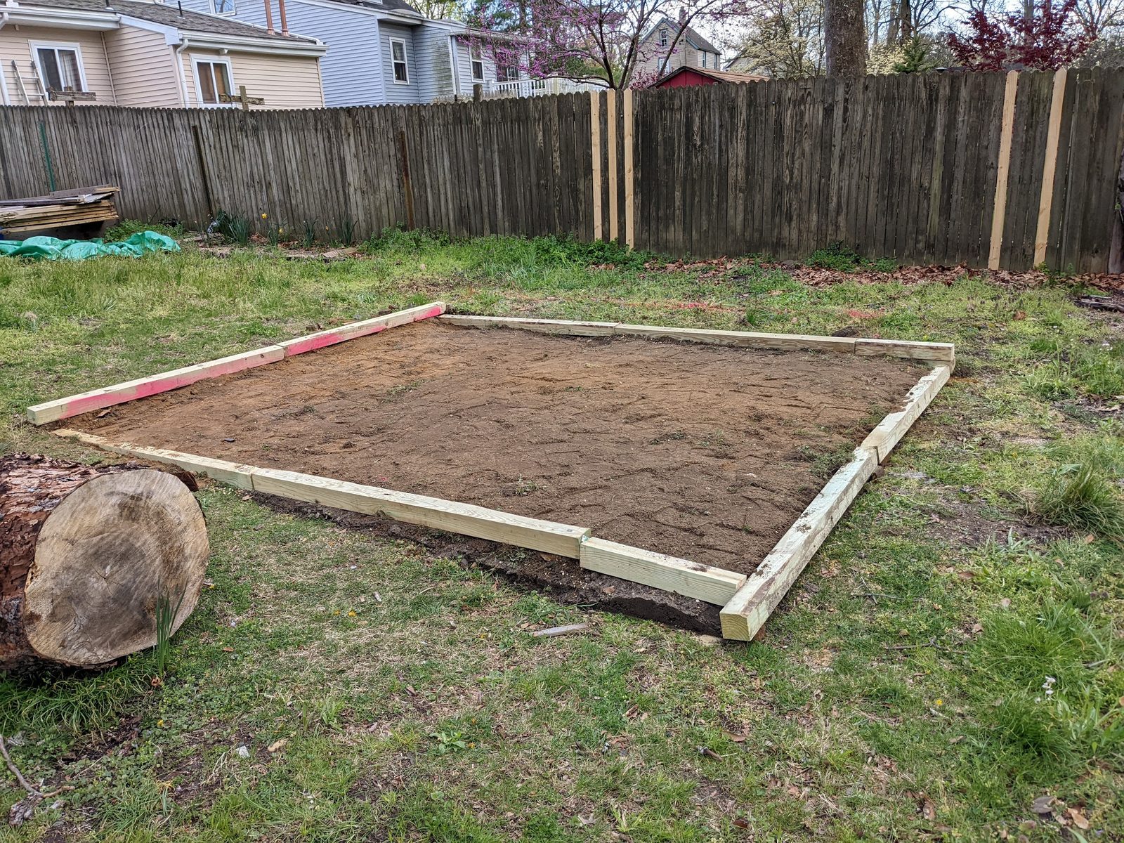 Cleared and leveled square dirt foundation at home for the rebuilt shed